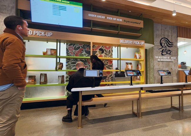 Early last year, Panera Bread debuted Panera To Go,  a compact, no-seats store format that lets customers quickly and easily pick up orders placed via kiosks or remote digital channels.  Photo courtesy of Panera Bread