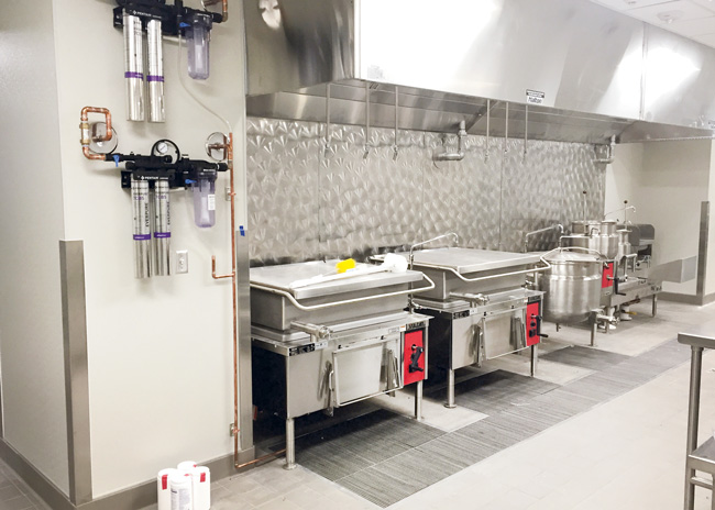 Changing water filter cartridges on a regular schedule is vital to the functioning of steam equipment, but the simple task is neglected often enough that some operators have their service agency do the switchouts.  Photo courtesy of Rapids Contract Foodservice and Design