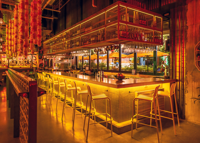 The bar at Hawkers is the focal point of the restaurant’s layout, bringing energy and activity to the whole dining area.