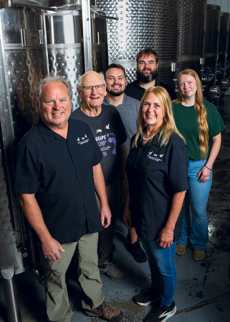 Ellenbecker family members in the production room at Round Lake Vineyards & Winery (clockwise from left): Scott; his dad, Bill; his sons, Mason and Logan; his daughter-in-law, Leah (Logan’s wife); and his wife, Jenny.