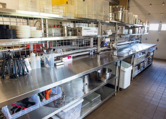 The main prep line includes plenty of room for the chicken and bison staff prep and vacuum-pack regularly. Chicken is smoked on-site, outdoors. The bison comes from a bison ranch run by owner Jenny Ellenbecker’s uncle; customers find a nod to this connection in the entree Uncle Rod’s Grilled Bison.