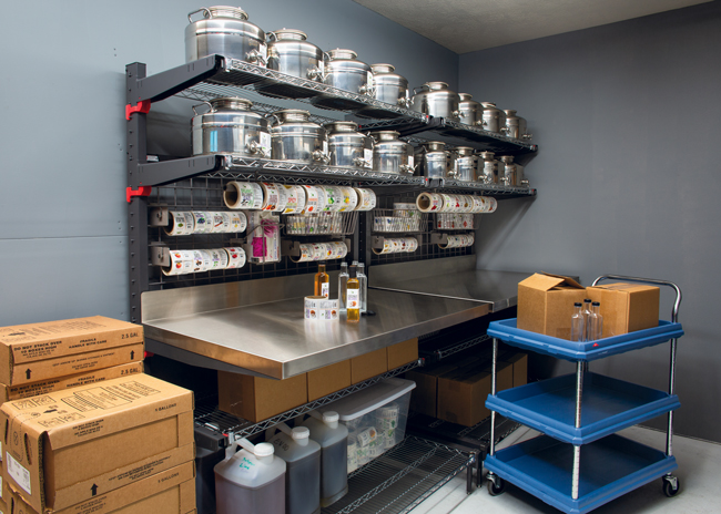 The makeover team created an olive oil and balsamic vinegar station in the storage room that makes it easy for staff to fill olive oil bottles for retail sale.