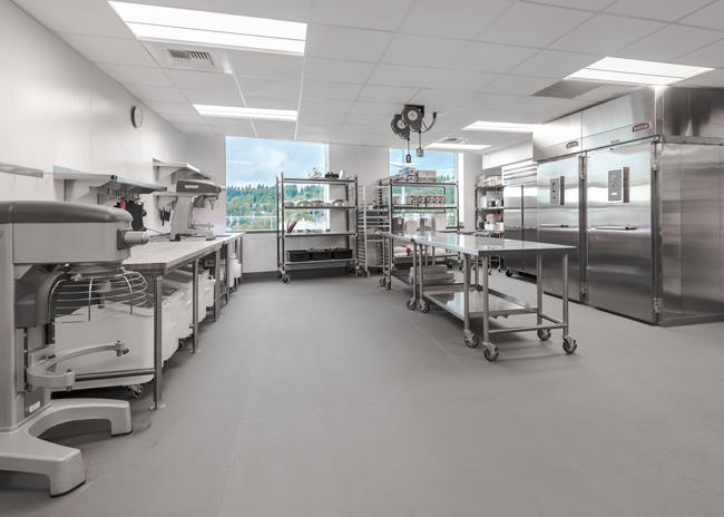 Windows in the kitchen bring in natural light for the culinary team.