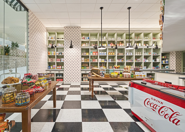 The Northstar Center in downtown Minneapolis, built in 1963 and reopened after a major renovation in 2025, is designed to accommodate the hybrid work era, with move-in-ready furnished Skybox offices, a 9-hole indoor golf course, a two-story bar, a fitness center and public meeting and event venues.&nbsp;Ground-floor food options include the Walkin’ Dog casual hot-dog eatery and a retro Northstar General Store. Photos courtesy of Rippe Associates, photos by Anthony Tahlier 