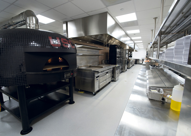 The back of house is visible in this servery, which is designed to highlight the dome oven.  Photo by Kyle Barber